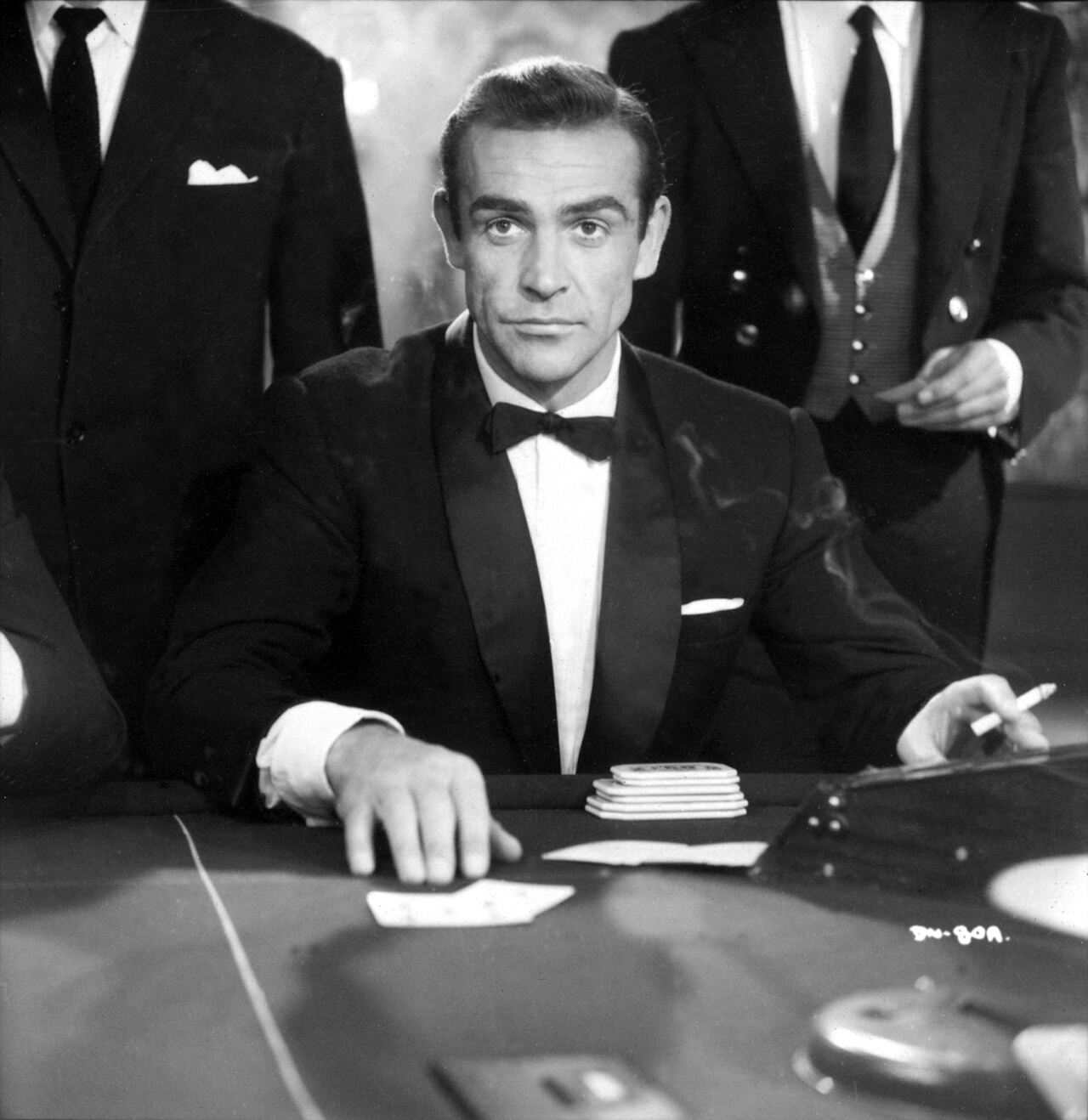 James Bond (Sean Connery) at the Chemin de Fer table at the 'Le Cercle' casino.