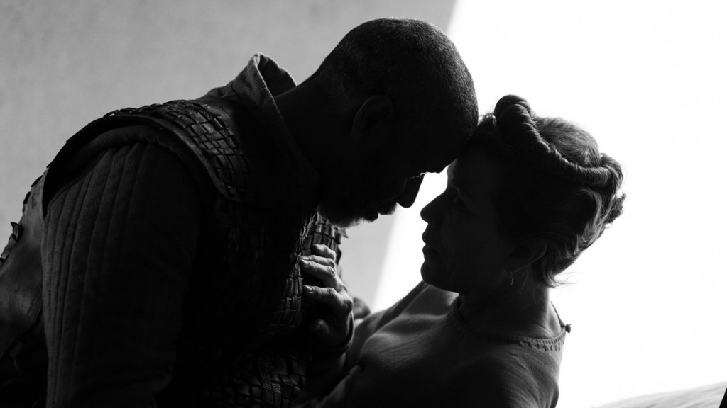 Macbeth and Lady Macbeth embracing, played by Denzel Washington and Frances McDormand