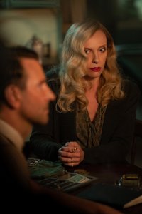 Bradley Cooper and Toni Collette in the film NIGHTMARE ALLEY. Photo by Kerry Hayes. © 2021 20th Century Studios All Rights Reserved