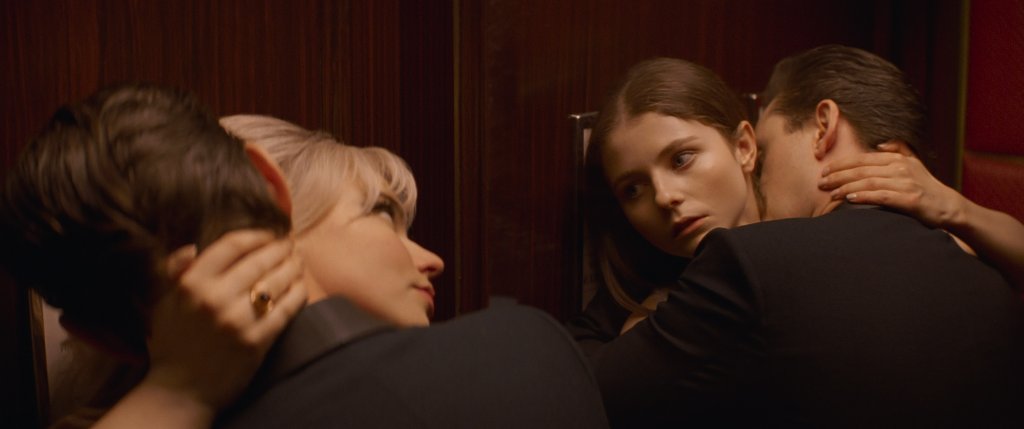 Anya Taylor-Joy and Thomasin McKenzie both embrace Matt Smith in Edgar Wright's supernatural horror Last Night in Soho