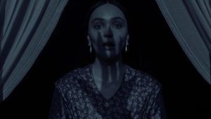 shadow of count orlok over lily rose depp in nosferatu