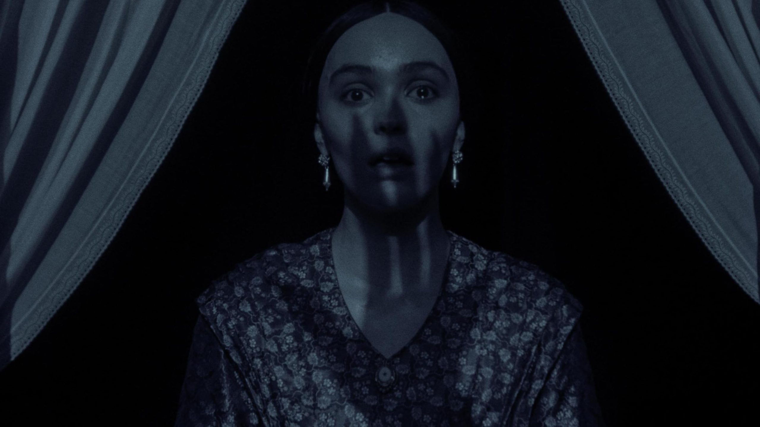 shadow of count orlok over lily rose depp in nosferatu