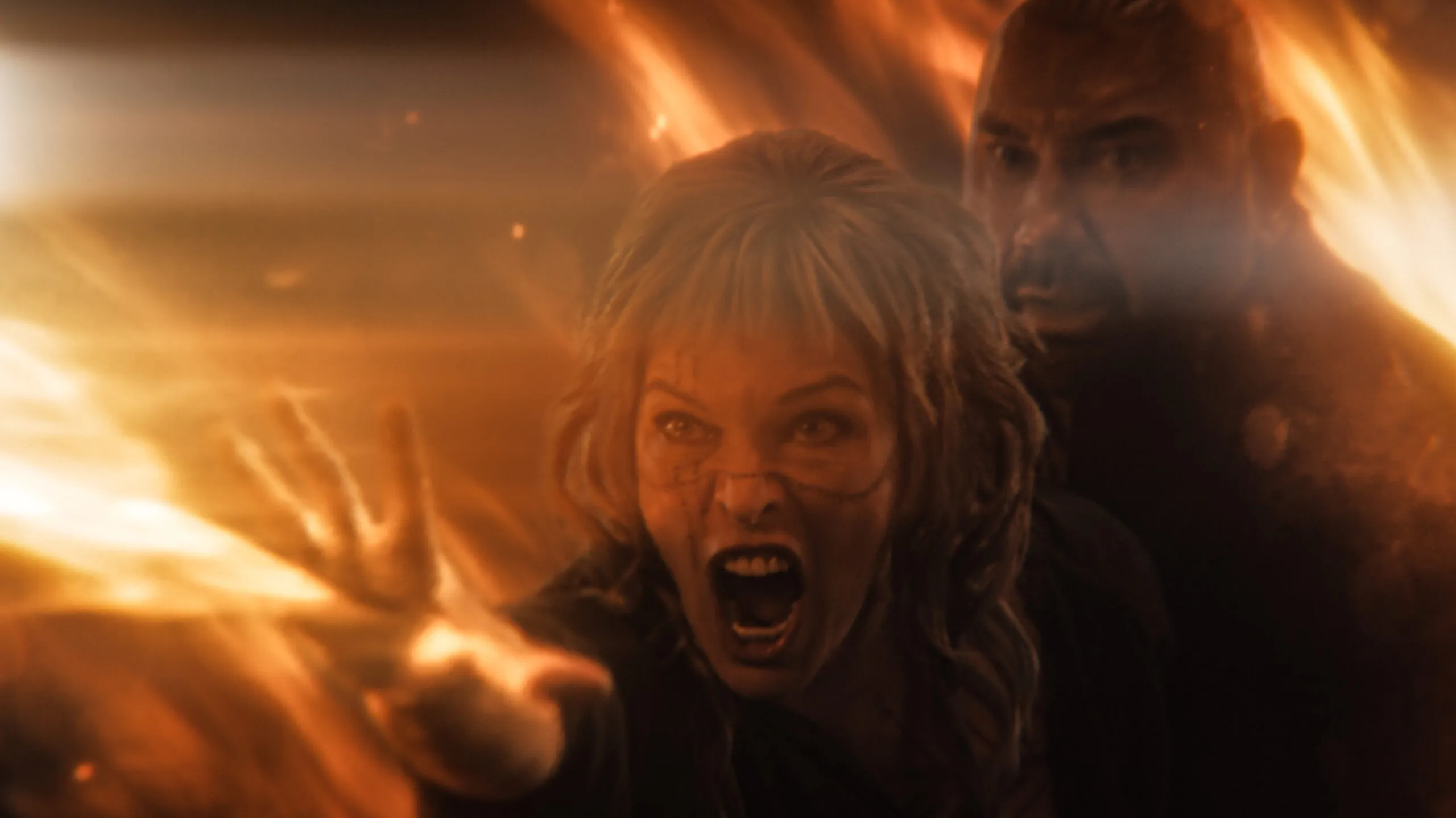 milla jovovich and dave bautista in the trailer for in the lost lands