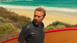 nicolas cage with surfboard in australia for the surfer by lorcan finnegan
