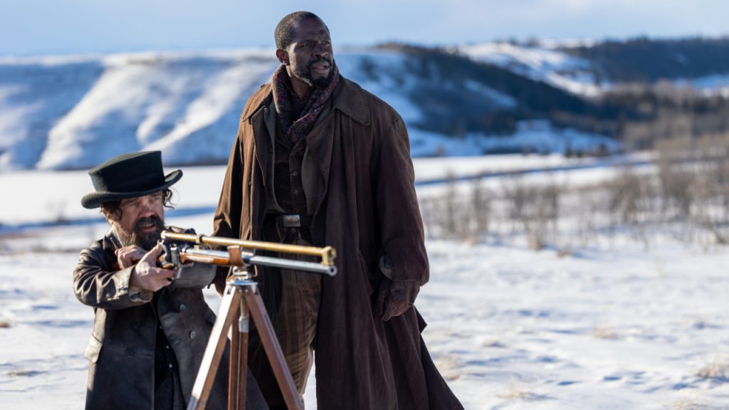 Reginald Jones (Peter Dinklage) takes aim with a rifle.